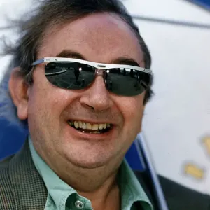 Ian McCaskill wearing a pair of Topman Sunglasses holding umbrella C / photo Ian McCaskill wearing a pair of Topman Sunglasses holding umbrella C / photo