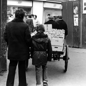 Illegal street trader Kit is on the move to evade police on 31st January 1981