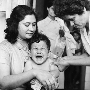 Immunisation - weeping Child getting injection. Circa 1965