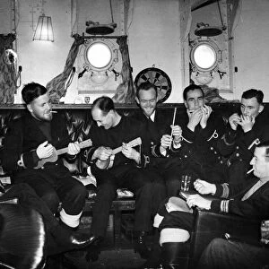 An impromptu concert in the wardroom of a British ship in a Royal Navy convoy inn