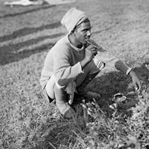 Indian soldier using a twig with the bark scraped off as a tooth brush