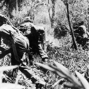 Indian troops of the Frontier Force Rifles launch an assault on a precipitous hill