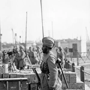 Indian troops in Orleans, France. Sentry guarding boxes of ammunition