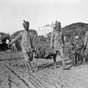 Indian troops seen off loading equipment from transports on their arrival at their rest
