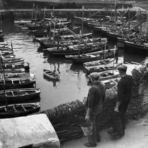 Industry: Fishing. The days work ended, fishing boats moved secure in the tiny harbour Industry: Fishing. The days work ended, fishing boats moved secure in the tiny harbour