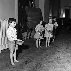 Infant schoolchildren playing during a dance and movement class. Feburary 1953 D715-006