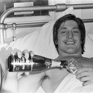 Injured English rugby player Tony Bond, with a broken leg in hospital