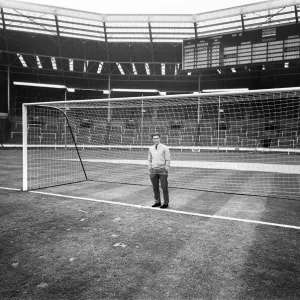 Injured Liverpool footballer Gordon Milne looks out over Wembley Stadium as his teammates Injured Liverpool footballer Gordon Milne looks out over Wembley Stadium as his teammates