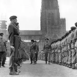 Inspecting officers move through the ranks of soldiers from the Durham Light Infantry T. A