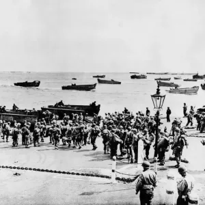 Invasion Embarkation. Battled-dressed U.s soldiers file down embarkment of an Invasion Embarkation. Battled-dressed U.s soldiers file down embarkment of an