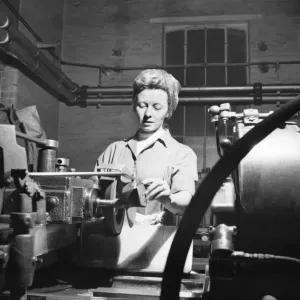 Invention Increases Production - Leyland Motors Ltd Mrs Joan McManmon shows the devices