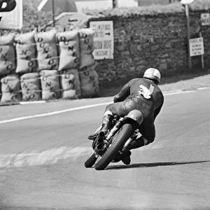 Isle of Man TT Races -250cc Event. Mike Hailwood on his way to set a new average