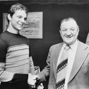 Israeli international footballer Avi Cohen skiing hands with Liverpool manager Bob