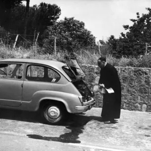 An Italian priest has trouble with his car on the Autostrada outside Naples An Italian priest has trouble with his car on the Autostrada outside Naples