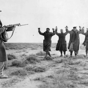Print of Italian soldiers surrendering to Australian soldier in Bardia, January 1941