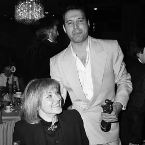 The Ivor Novello Awards. Pictured, Freddie Mercury of Queen and Mary Austin