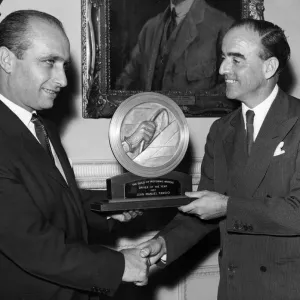 J. M Fangio wins driver of the year award from the guild of motoring writers J. M Fangio wins driver of the year award from the guild of motoring writers