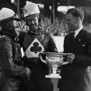 Jack Rowley of Manchester United presenting the cup to Speedway champion Jack Parker