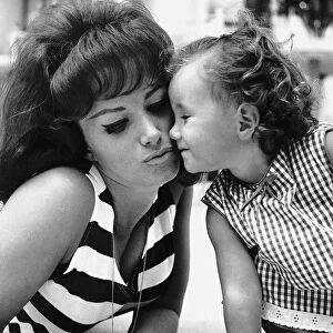 Jackie Collins Actress and Writer playing with her daughter Tracey Collins dbase