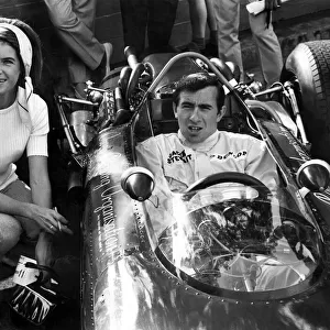 Jackie Stewart and his wife Helen in his B. R. M. seen here on practice day for the 1966