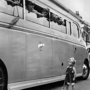 Jacqueline Gordon aged 3, standing by a school bus full of children. July 1952 Jacqueline Gordon aged 3, standing by a school bus full of children. July 1952