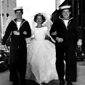 James Ellis actor and Colin Welland actor as Sailors walk with bride July 1964 James Ellis actor and Colin Welland actor as Sailors walk with bride July 1964