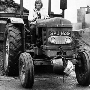 James Hunt former motor racing world champion driver driving a tractor January 1982