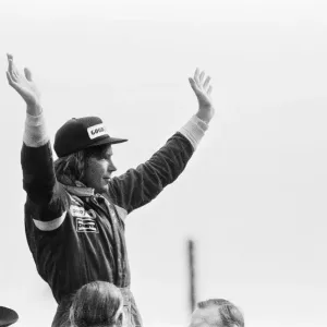 James Hunt on the podium celebrates winning The 1977 British Grand Prix Formula One