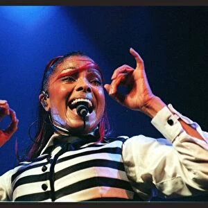 Janet Jackson in concert at the SECC June 1998 singing into microphone