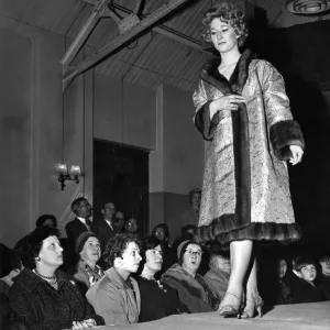 Janet Thompson in a brocade-lined wild mink, worn inside out displays the coat