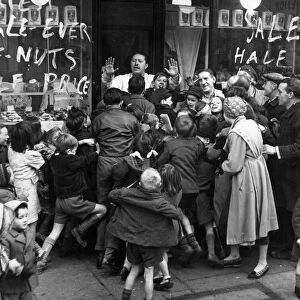 January Sales. A queue of anxious shoppers try to be first into the shop as the shop