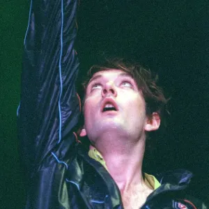 Jarvis Cocker of pop group Pulp on stage at T in the Park on Sunday with arm raised in Jarvis Cocker of pop group Pulp on stage at T in the Park on Sunday with arm raised in