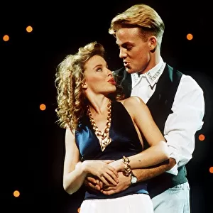 Jason Donovan actor singer arms round Kylie Minogue