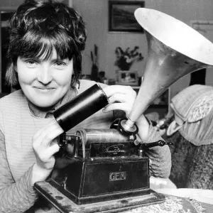 Jean Dixon pictured with her cylinder type phonograph made by the American company Jean Dixon pictured with her cylinder type phonograph made by the American company