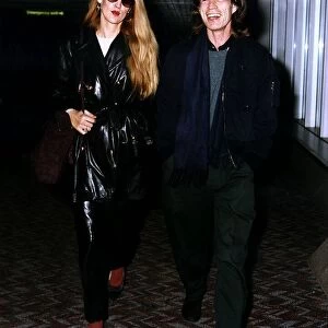 Jerry Hall and Mick Jagger at Heathrow Airport. February 1993