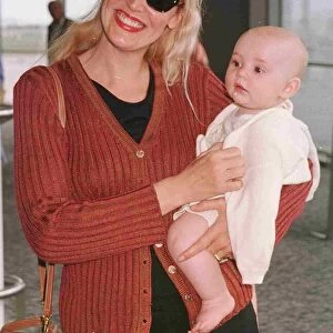 Jerry Hall model actress and new baby Gabriel June 1998 arrive at Heathrow from Nice