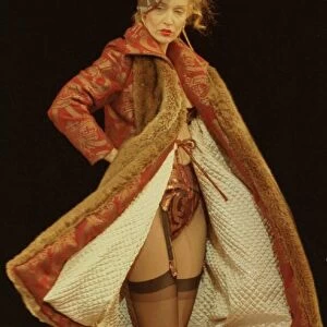 Jerry Hall models for Vivienne Westwood at Paris Fashion Week Wearing a long coat