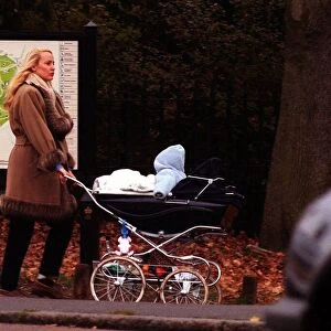 Jerry Hall in Richmond Park London in December 1998, pushing the pram of her fourth child