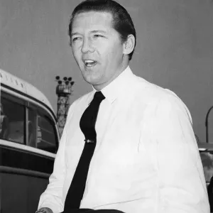 Jerry Lee Lewis, pictured arriving at London Airport to start his second tour of England Jerry Lee Lewis, pictured arriving at London Airport to start his second tour of England