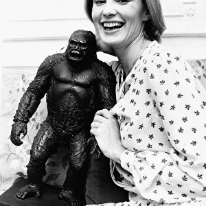 Jessica Lange Actress holding a model of King Kong after arriving in London Dbase MSI