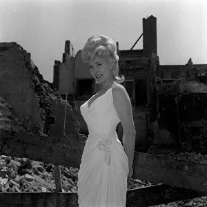 Jill Day actress singer June 1962 poses at demolished bomb site