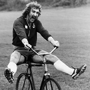 Jim Cannon of Crystal Palace riding a bicycle during a training session