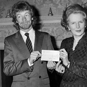 Jim Davidson presenting cheque to Margaret Thatcher during reception at Number 10 Downing