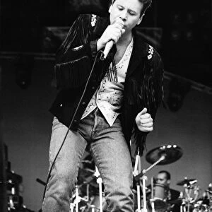 Jim Kerr, lead singer of the rock group Simple Minds entertains the crowd at the groups
