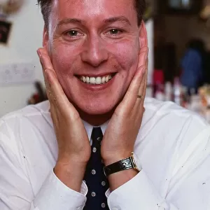 Jim White with his hands on his face after having moustache shaved off August 1988