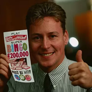 Jim White holding Daily Record and Sunday Mail bingo card September 1989