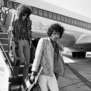 Jimi Hendrix arrives with members of his band "The Jimi Hendrix Experience"
