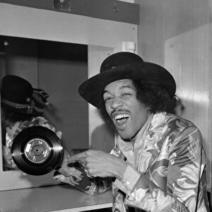 Jimi Hendrix pointing to a copy of his new 7"release with Curtis Knight - Hush Now