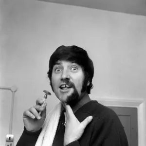 Black and white print of Jimmy Tarbuck in the process of shaving a beard Black and white print of Jimmy Tarbuck in the process of shaving a beard