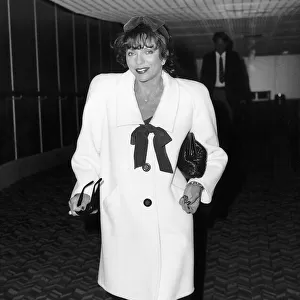Joan Collins actress starred in Dynasty arrives Heathrow Airport, March 1988